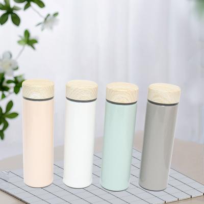 China Sustainable Wood Grain 500ml Color Lid Stainless Steel Double Wall Insulated Vacuum Flask Tea Infuser Water Bottle for sale