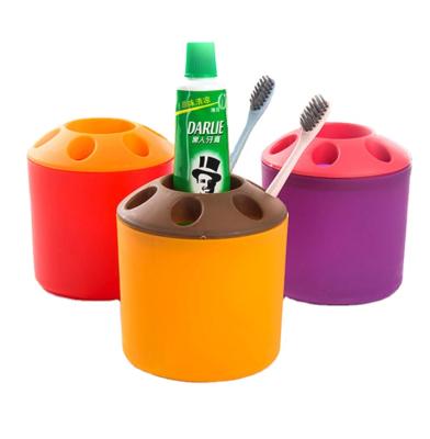 China Sustainable Candy Roll Colorful Plastic Round Toothbrush Holder for sale