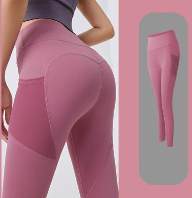 China Breathable High Waisted Yoga Women's Naked Feeling Workout Gaiters Yoga Pants With Side Pockets for sale