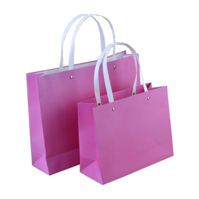 China Handmade Wholesale Custom Printed Your Own Logo Recycled Pink Paper Bag Women Shopper Handbags With Handle for sale