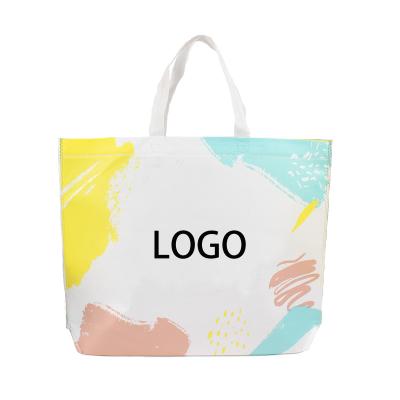 China Recyclable wholesale non woven handbag advertising clothing shopping bag can be customized logo printed coated bag for sale