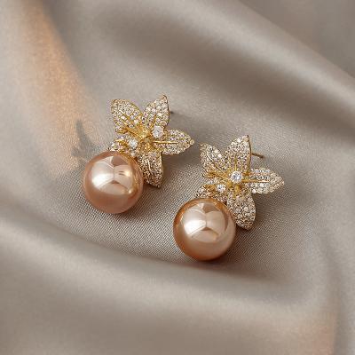 China The Other Korean Simple Elegant Jewelry Wholesale Champagne Flower Pearl Earrings Personality Brincos for sale