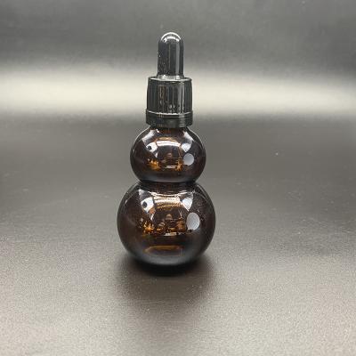 China 20ml 30ml 50ml Skin Care Glass Bottle Essential Oil Bottle Gourd Shape Cosmetic Dropper Bottle for sale