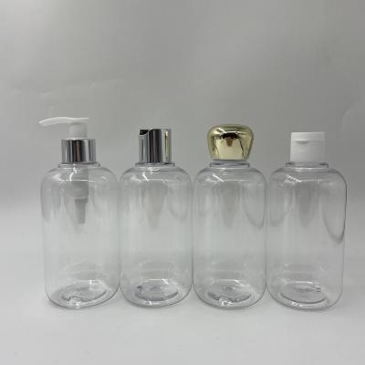 China Round Cosmetic Plastic Boston Bottles With Smooth Top Caps Pet Bottles With Lotion Pump 300Ml Shampoo Bottle Disc Top for sale