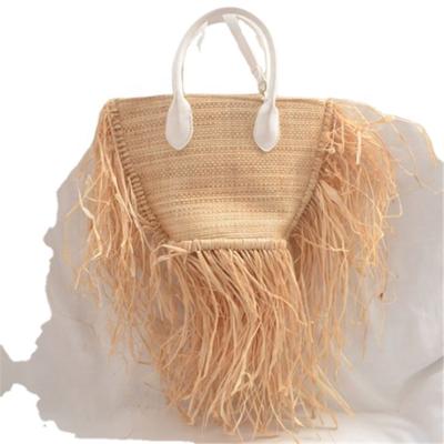 China 2021 New Vintage Summer Women Elegant Lady Long Tassels Natural Raffia Straw Bag For Beach Resort Dress for sale