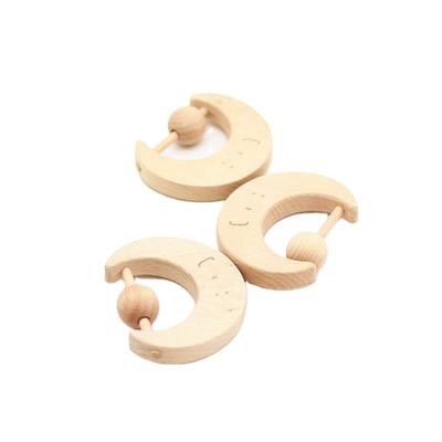 China Custom Wooden Rattle Baby Teether Baby Moon Shape Wooden Logo Organic Baby Toy for sale