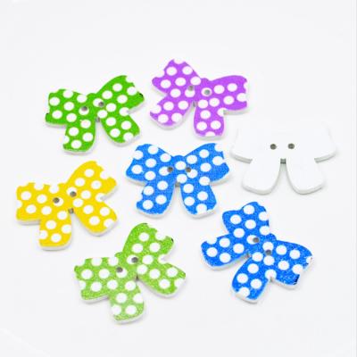 China Other Beautiful Two Hole Polka Dot Printed Bowknot Design Wooden Buttons For Decoration for sale