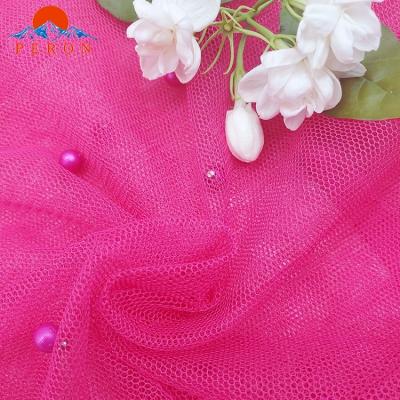 China Stretch Make To Order Stretch Mesh Quick Dry Beaded Fabric 100% Knitted Tulle Polyester Fabric for sale