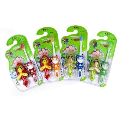 China Wholesale Disposable Cartoon Shape Handle Kids Toothbrush With Toy for sale