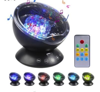 China Music Player Speaker Light Waves Led Light 7 Colors Changing Sleepless Night Light Projector for sale