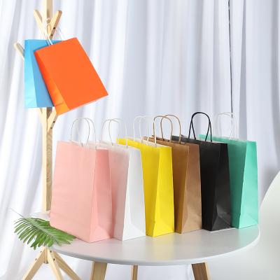 China Biodegradable Eco Friendly Colorful Paper Package Bags Cloth Hand Boutique Shopping Custom Bag for sale