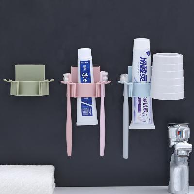 China Stocked Toilet Toothbrush Toothpaste Cup Holder Wall Mounted Punchless Holder for sale