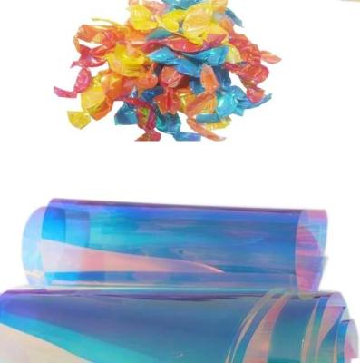 China Wholesale Rainbow Film Natural PVC Candy Twist Sequin Film For Packing And Decoration for sale