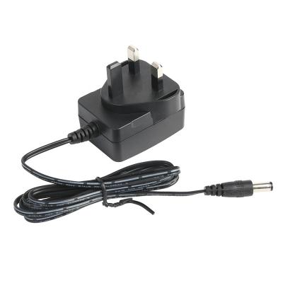 China 12V 1.5A UK Plug AC DC Power Adapter USB Charger with UKCA CE Standard EN61558 YS-M06-B3 Certificate for sale