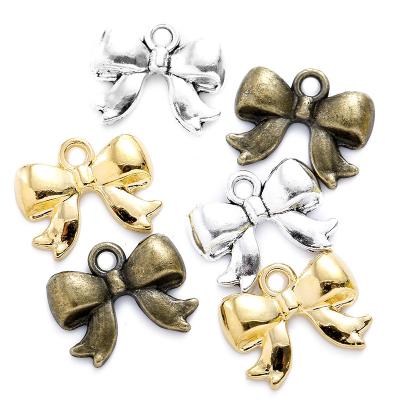 China TRENDY 100pcs/bag 3 colors bow knot charm bracelet necklace pendants for DIY jewelry making 18*14mm N164 for sale