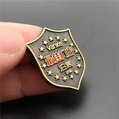 China New Custom Europe Charm Shield Grill Metal Antique Lapel Pin Badges for sale