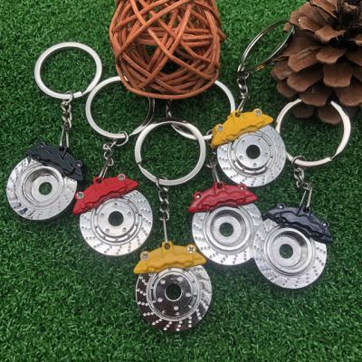 China Car Parts Roll Rim Keychain 3D Luxury Cool Car Parts Roll Rim Hub Auto Ring Metal Keychain Metal Key Chain for sale