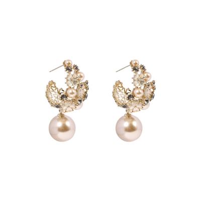 China Palace wind flower earrings temperament temperament white pearly white pearly super fairy elegant personality exaggerated pearl sta hollow tide S925 silver for sale