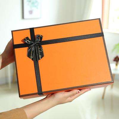 China Rectangular Recyclable Orange Gift Box Ribbon Bow Gift Box Sky And Earth Cover Custom Lipstick Creative Packaging Box for sale