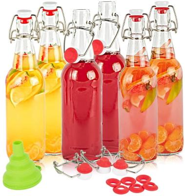 China Clear Beverage 330ml 500ml Swing Top Glass Bottles 16oz Kombucha Bottle for sale