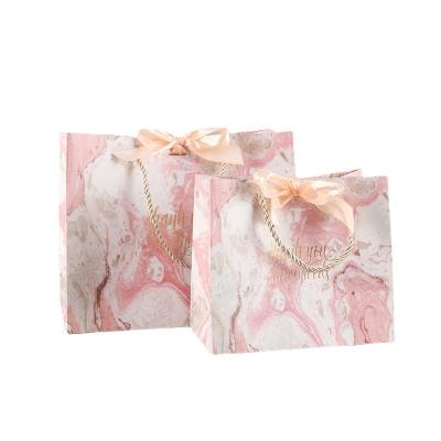 China Qianheng Recyclable Multi Colors Wedding Fancy Bags Gift Paper Bag With Ribbon Bow for sale