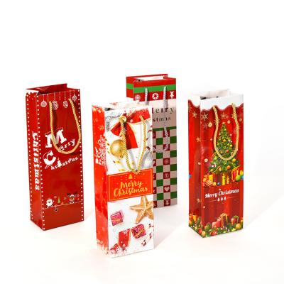 China Qianheng Christmas Gift Bags Recyclable Custom Paper Wine Bags Christmas Wine Bottle Packaging Eco Friendly Paper Bag for sale