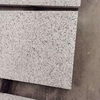 China Modern Bush Hammered Thick Sesame White Granite Cobblestones Outdoor Flooring Faced Tiles for sale