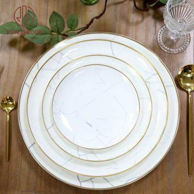 China Good Viable European Style Bone China Wedding Gold Charger Plates Luxury Ceramic Gold Rim Round Dinner Sets for sale