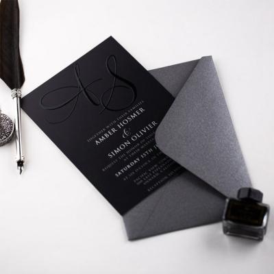 China Unique Europe Black And White Embossed Monogram Wedding Invitations Engagement Party UV Printing Card for sale