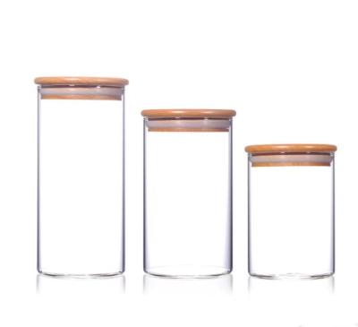 China Cover Heat Resistant Clear Glass Jar with Bamboo Lids, Tea Candy Foods Wooden Lid Air Storage Containers Rubber Sealed Glass Jar for sale