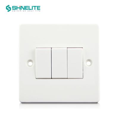 China High Quality Bakelite English Standard Electric Switch Wall Lamp Switch 3 Gang 1 Way Switch for sale