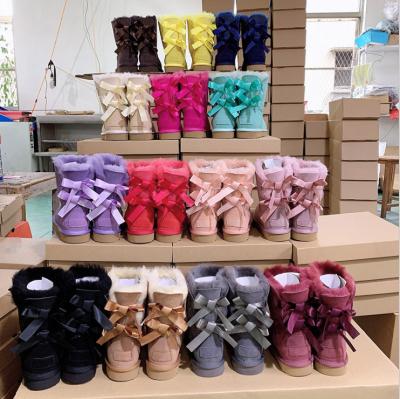 China Wholesale Women Anti-slippery Winter Sheepskin Fur Ladies Ladies Warm Fashion Snow Boots With Bows for sale