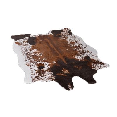 China Wholesale Anti-Slip Area Rugs Wholesale Polyester Cowhide Faux Cowhide Material Whip Shaped Rug for sale