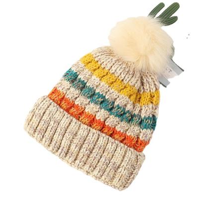 China JOINT Wholesale Custom Logo Hats Winter Warm Stripe Woman Wool Beanie Knit Hats With Pom Pom for sale