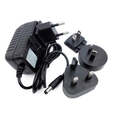 China Interchangeable Plug 18w Power Adapter 9v 2a Wall Mount Charger With 1.2m 9V 2A Power Cord for sale