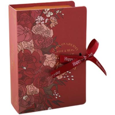 China Recycled Materials Wholesale Luxury Flat Pack Folding Cardboard Paper Box Ribbon Closures Book Shaped Foldable Packaging Gift Boxes for sale