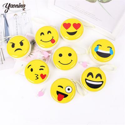 China Fashion winter spring hot selling children's fashion smiling face design metal round keychain wallet coin purse mini coin change purse for sale