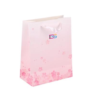 China Free Sample Disposable Custom Logo Tissue Rose Cardboard Luxury Paper Bag With Ribbon Handle for sale