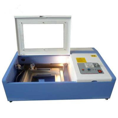 China laser CUT rubber stamp laser machine cheap price small engraver 40w laser cut machine malaysia for sale