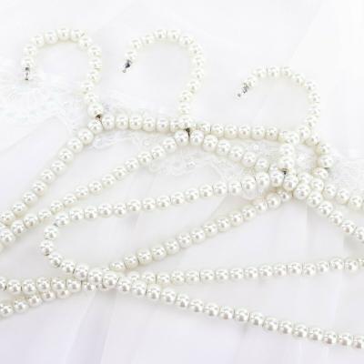 China Premium Quality Metal Color Metal Color Hanger Holder Pants Bar Hanger Elegant White Wedding Dress Pearl Clips Bead Hanger for sale