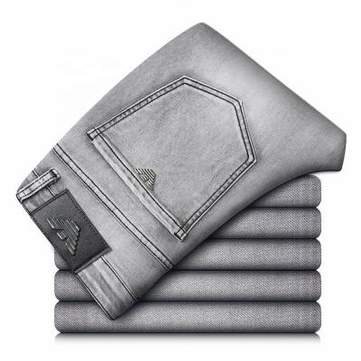 China European and American tight breathable solid color high-grade thin jeans brand elastic leisure Korean men's gray business long jeans for sale