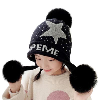 China COMMON Home Prefer Girls Double Pom Earflaps Kids Winter Warm Beanie Fuzzy Peruvian Hat Children's Knitted Hat for sale