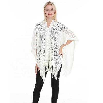 China 2020 Trendy Acrylic Knit Shawl Wrap For Women Ladies Fringe Hollow Out Knitted Ponchos for sale