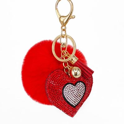 China 2020 Hot Selling Eco-friendly Tassel Faux Fur Pom Poms Key Chain With Rhinestone Heart Charms For Bags Keys for sale