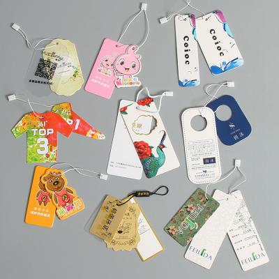 China Viable China Cheap Fold Over Design Custom Logo Printed 400gsm Luxury Paper Cardboard Kraft Garment Jewelry Hang Tags With String for sale