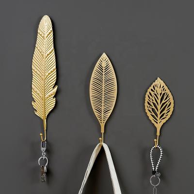 China Golden Art Hooks Leaves Shape Free-Hole Wall Viable Hook Iron Coat Rack Key Towel Hanger For Home Decoration for sale