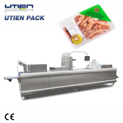 China Hot sale full automatic cooked fast food thermoforming packing machine for sale