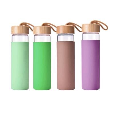 China Sustainable Custom Eco Friendly High Borosilicate Glass Water Bottle With Natural Bamboo Lid for sale