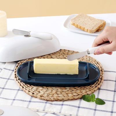 China Sustainable ceramic butter container with magnetic butter dish with kinfe for sale