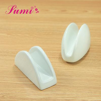 China Eco-friendly Wholesale Luxury Paper Restaurant Holder Morden Porcelain White Ceramic Napkin Holder Dinner for sale